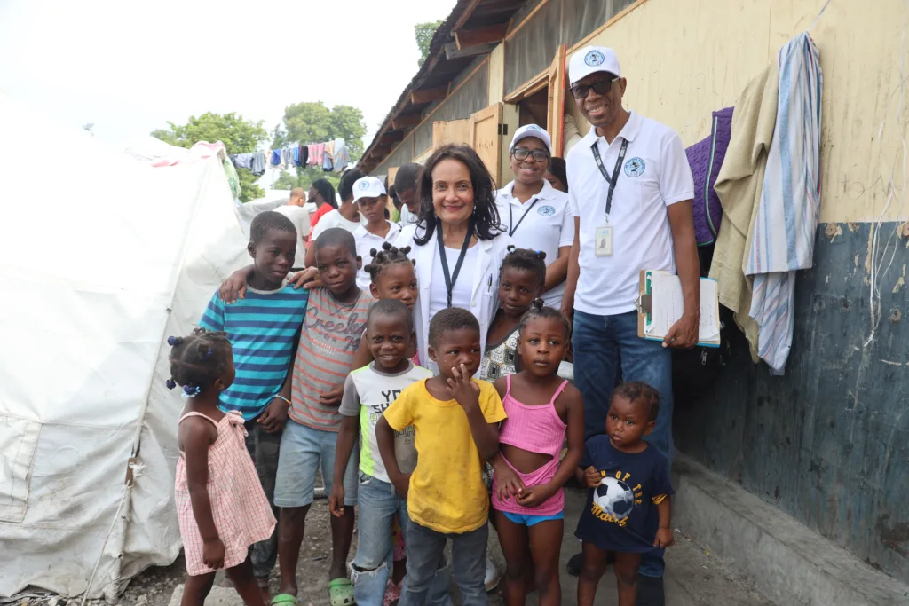 Dr. Marie-Marcelle Deschamps with the children of Haiti